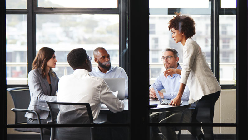 affility-business-transformation Team discussing business advisory strategies.