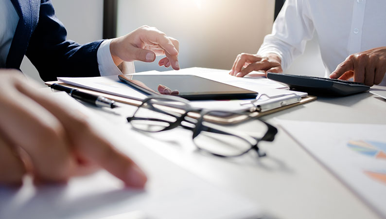 Team working on a business restructuring plan.