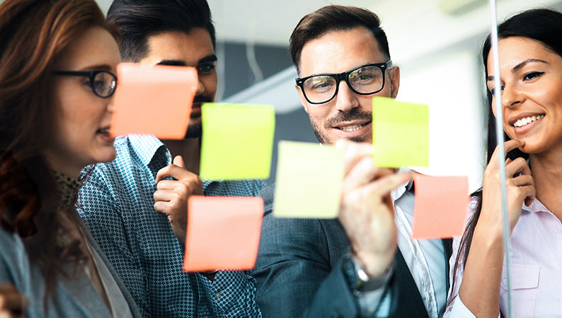 BusinessRestructuring_Third Professionals reviewing restructuring strategies.