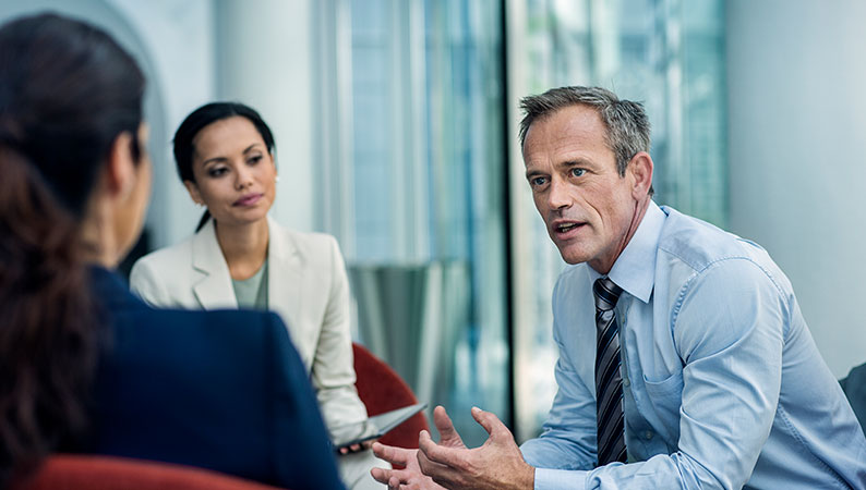 Team refining a document for SOP development.